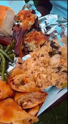 Home-style spread of lamb chops, seafood rice, green beans, stuffed shells and bread